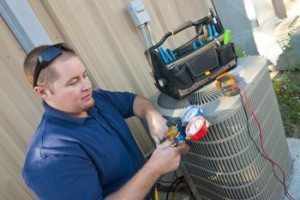 Technician Inspecting Air Conditioner